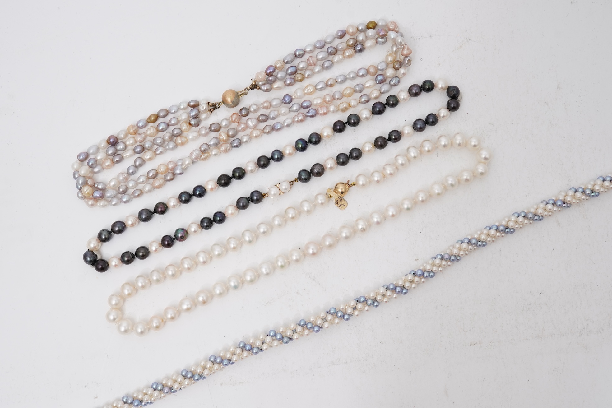 A collection of four cultured pearl necklaces